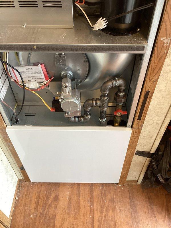 Successfully completed full HVAC system installation including a 70,000 BTU furnace and 2.5 ton air conditioning unit with rear discharge configuration. Installed new gas valve assembly with proper piping connections, completed all electrical wiring and control connections, and secured unit in designated utility closet space. All permits were obtained prior to installation, system was tested and reconnected to existing infrastructure, and installation meets manufacturer specifications and local mechanical code requirements.