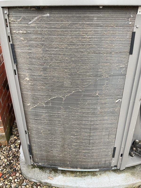 Performed annual cleaning and maintenance on outdoor HVAC unit. Condenser coil fins were found heavily clogged with dirt, dust, and debris accumulation, significantly restricting airflow. Thoroughly cleaned condenser coils to restore proper heat transfer efficiency. Conducted electrical diagnostics using clamp meter to verify system amperage and confirm proper operation of all electrical components.