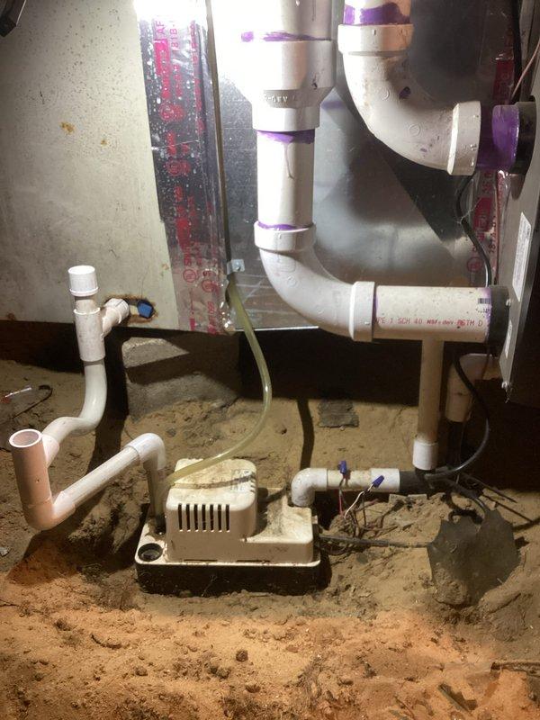 Responded to no heat call on 2-year-old furnace located in basement. Upon inspection, discovered condensate pump failure causing safety switch to shut down system. Replaced failed condensate pump, verified proper drainage through PVC condensate lines, tested all electrical connections at GFCI outlet, and confirmed furnace operation. System restored to full heating capacity with all safety controls functioning properly.