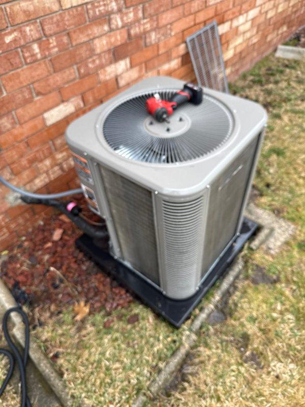 Completed routine Air Care Cooling maintenance on residential outdoor condensing unit. Performed standard ACM inspection protocol including visual assessment of unit condition, refrigerant line inspection, and verification of proper equipment placement on protective pad. Unit found in operational condition with manufacturer labeling intact and all components accessible for service.