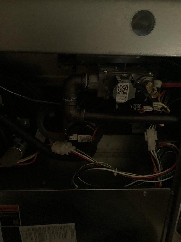 Completed scheduled maintenance on HVAC system including both heating and cooling components. Replaced air filter and evaporator pad as part of routine Air Care service. Performed visual inspection of furnace interior, verifying all electrical connections, gas valve operation, and control components were functioning properly. All wiring harnesses and safety labels intact and in good condition. System operational and ready for continued service.