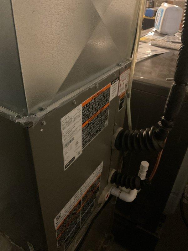 Completed installation of 2.5-ton Lennox air conditioning system with matching evaporator coil at rear location of residence. Installed outdoor condenser unit on protective base pad with proper electrical disconnect and reconnection of existing power supply, mounted indoor evaporator coil in utility closet with condensate drain lines and flexible ductwork connections. Mechanical permit obtained prior to installation, all components tested and operational upon completion.