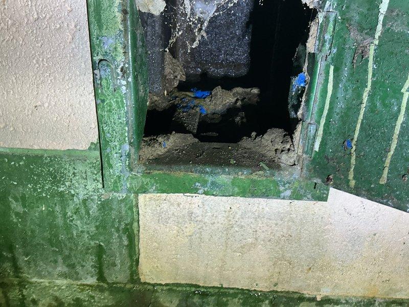 Completed complimentary annual furnace maintenance and tune-up on a new furnace system with no operational issues reported. Performed comprehensive inspection of HVAC equipment and documented existing structural concerns in the utility area, including significant water damage on the concrete floor and deteriorated wall opening with damaged framing that may affect system performance if moisture intrusion continues.