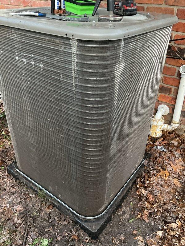 Completed routine preventive maintenance on residential outdoor air conditioning condenser unit. Performed comprehensive system inspection, placed diagnostic tools and gauges on unit to check refrigerant pressures and system performance, cleaned condenser coils, verified proper operation of all components, and inspected condensate drain lines. Unit operating within normal parameters with no immediate repairs required.