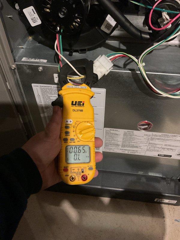 Completed annual furnace maintenance and tune-up on a brand new system with no reported issues. Performed comprehensive diagnostic testing including electrical measurements using digital multimeter to verify proper motor amperage and system operation. Conducted thorough inspection of blower motor assembly, control board connections, and all electrical wiring throughout the air handler unit to ensure optimal performance and safety compliance.