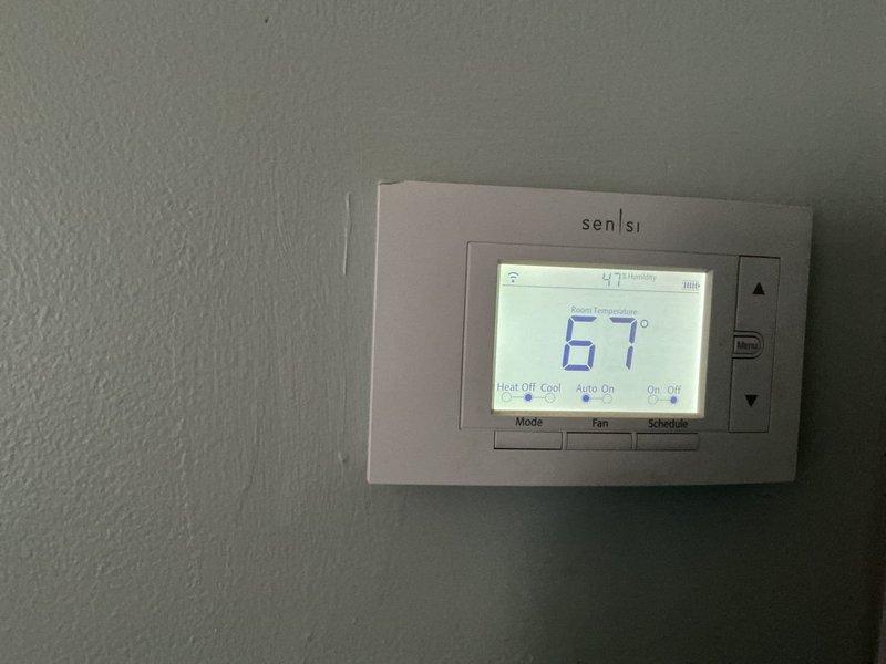 Completed annual heating maintenance service on residential HVAC system. Performed comprehensive system inspection, replaced air filter and humidifier pad as needed, verified thermostat operation and calibration showing proper functionality at 67°F ambient temperature with humidity reading of 47%. All components operating within normal parameters.