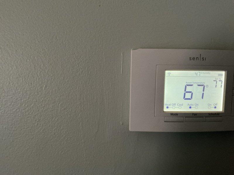 Completed annual heating maintenance service on residential HVAC system. Performed comprehensive system inspection, replaced air filter and humidifier pad as needed, verified thermostat operation and calibration showing proper functionality at 67°F ambient temperature with humidity reading of 47%. All components operating within normal parameters.