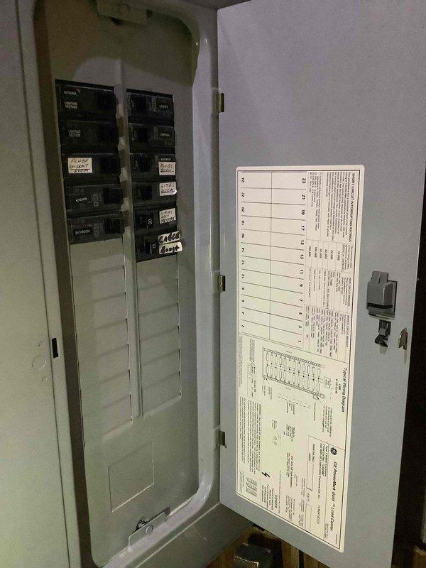 Conducted comprehensive site appraisal for new Generac generator installation at residential property over 50 years old. Evaluated existing electrical infrastructure including multiple breaker panels, assessed main service panel capacity and circuit breaker configuration, and documented electrical room conditions with exposed studs and existing conduit routing. Photographed electrical panels and utility space to determine proper sizing requirements and optimal installation approach for standby generator system.