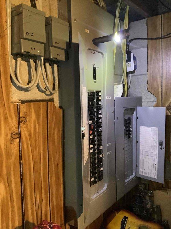 Conducted comprehensive site appraisal for new Generac generator installation at residential property over 50 years old. Evaluated existing electrical infrastructure including multiple breaker panels, assessed main service panel capacity and circuit breaker configuration, and documented electrical room conditions with exposed studs and existing conduit routing. Photographed electrical panels and utility space to determine proper sizing requirements and optimal installation approach for standby generator system.