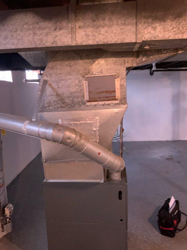 Conducted in-home consultation and site assessment for full central air conditioning system installation in a two-story 1,000 square foot residential property. Evaluated existing basement HVAC infrastructure, including current Goodman furnace unit and ductwork configuration to determine compatibility and requirements for new AC system integration. Documented existing equipment condition, ductwork layout, and basement utility space constraints through photographic documentation to prepare comprehensive installation estimate for complete central air conditioning system addition to existing forced-air heating setup.