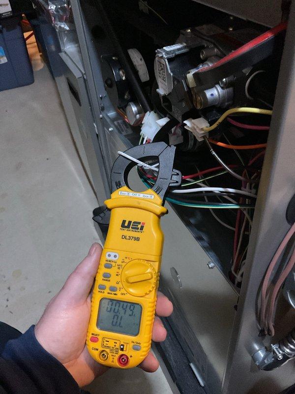 Completed comprehensive Air Care heating and cooling maintenance service on HVAC system. Performed electrical diagnostics using clamp meter to verify proper amperage draw and system performance. Replaced furnace filters, inspected blower motor assembly and capacitor, and verified all electrical connections and wire bundling were secure. All components operating within normal parameters upon completion of preventative maintenance procedures.