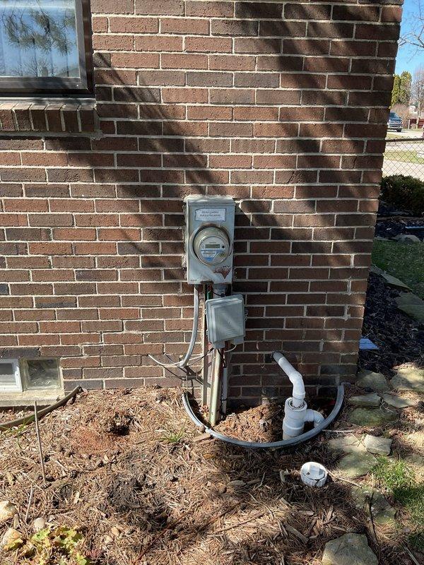 Completed comprehensive whole home electrical inspection of residential property. Evaluated original electrical service panel and breaker box, identifying several breakers with loose connections requiring attention and potential replacement. Inspected exterior meter installation, service entrance conductors, and associated conduit system mounted on brick exterior wall. Documented current electrical system conditions through photographic evidence for maintenance planning and safety compliance recommendations.