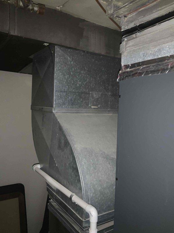 Performed site assessment for air purification system installation compatibility with existing HVAC equipment. Measured and photographed ductwork configuration and furnace unit in basement mechanical room to verify proper fitment specifications for Healthy Climate Filter Media Model PCO3-20-16. Confirmed equipment dimensions and spatial requirements to ensure quoted air purifier will integrate correctly with current system layout.