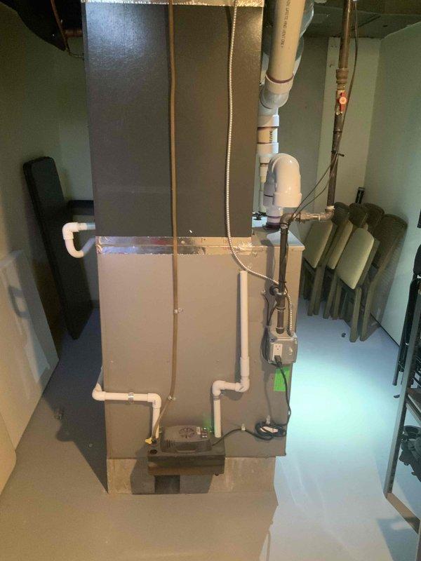 Performed site assessment for air purification system installation compatibility with existing HVAC equipment. Measured and photographed ductwork configuration and furnace unit in basement mechanical room to verify proper fitment specifications for Healthy Climate Filter Media Model PCO3-20-16. Confirmed equipment dimensions and spatial requirements to ensure quoted air purifier will integrate correctly with current system layout.