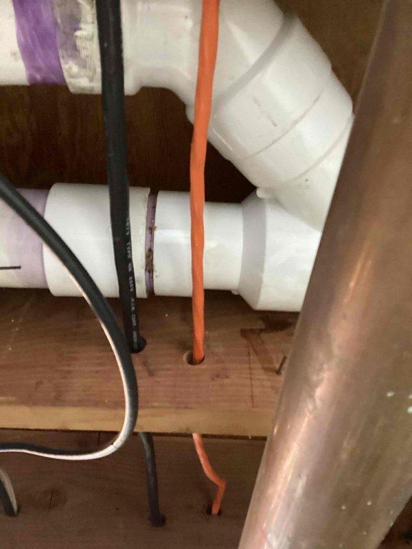 Responded to callback for water leakage at furnace exhaust penetration point. Inspected 90,000 BTU furnace and 3-ton air conditioning system installation in basement, focusing on PVC exhaust venting where it exits through exterior wall. Examined condensate drainage routing, PVC pipe joints, and penetration sealing to identify source of interior water intrusion and made necessary corrections to prevent further leakage.