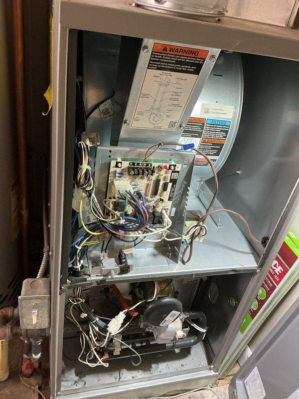 Performed city certification inspection and complete furnace cleaning and check on residential HVAC system. Accessed unit cabinet, inspected all internal components including blower motor assembly, control board, electrical connections, and refrigerant lines. Verified proper operation of all safety controls, circuit breakers, and wiring harnesses. Cleaned blower assembly and internal surfaces, checked copper refrigerant line connections, and ensured all warning labels were legible and properly affixed. System tested and confirmed operational within manufacturer specifications. Advised occupant that any required certification paperwork must be present at the property for completion.