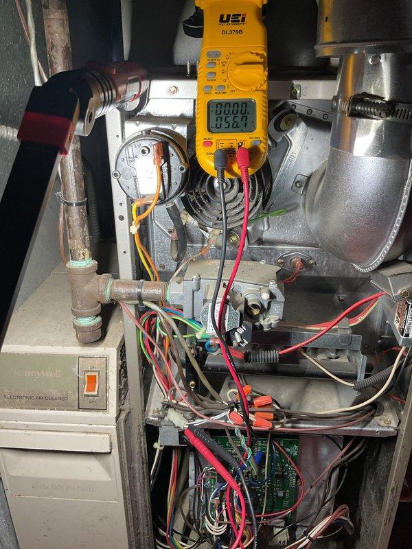 Performed comprehensive furnace tune-up and maintenance on heating system. Conducted electrical diagnostics using digital multimeter to verify proper voltage and amperage readings across gas valve assembly and control circuits. Inspected all electrical connections, wiring, and safety controls within the unit. Tested blower motor operation and verified proper function of all system components. System operating within normal parameters with no issues identified at time of service.