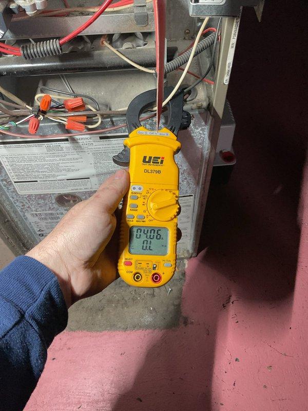 Performed comprehensive furnace tune-up and maintenance on heating system. Conducted electrical diagnostics using digital multimeter to verify proper voltage and amperage readings across gas valve assembly and control circuits. Inspected all electrical connections, wiring, and safety controls within the unit. Tested blower motor operation and verified proper function of all system components. System operating within normal parameters with no issues identified at time of service.