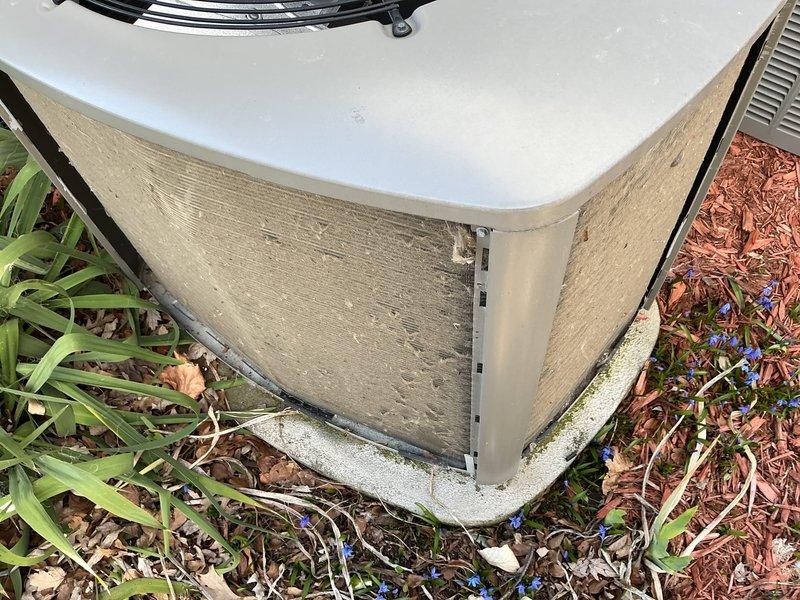 Completed scheduled ACM maintenance on residential outdoor condensing unit. Performed visual inspection of equipment exterior, noting normal weathering and dirt accumulation on cabinet panels consistent with outdoor exposure. Unit positioned on stable concrete pad with adequate clearance; observed detached access panel requiring reinstallation. Documented equipment condition through photographic records showing unit accessible for routine maintenance with surrounding landscaping requiring minor debris clearance for optimal airflow.