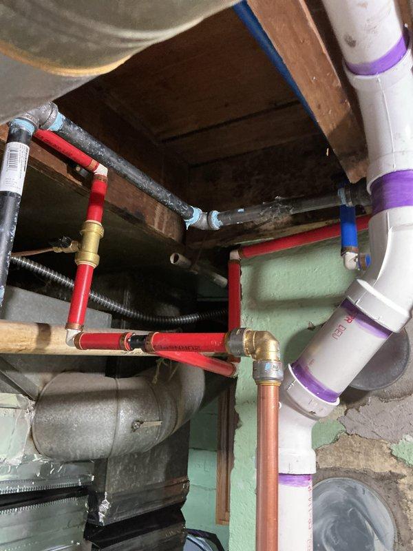 Successfully installed a 40-gallon power vent water heater in the basement mechanical room. Completed all necessary plumbing connections using PEX supply lines with brass fittings and proper support clamps, installed PVC venting with purple-primed joints per code requirements, and reconnected all water supply and drainage systems. All required mechanical permits were obtained and the installation was completed to code specifications with proper clearances and secure mounting.