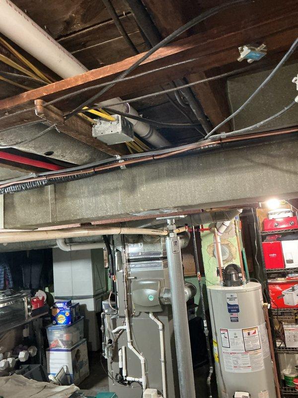 Successfully installed a 40-gallon power vent water heater in the basement mechanical room. Completed all necessary plumbing connections using PEX supply lines with brass fittings and proper support clamps, installed PVC venting with purple-primed joints per code requirements, and reconnected all water supply and drainage systems. All required mechanical permits were obtained and the installation was completed to code specifications with proper clearances and secure mounting.