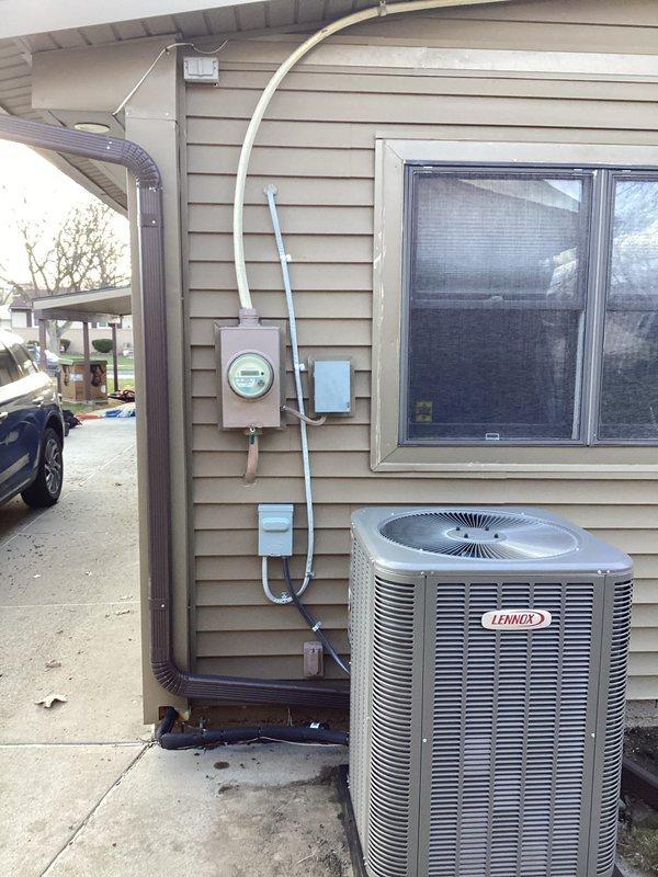 Completed full HVAC system installation including a 70,000 BTU furnace, 2-ton air conditioning unit, and hot water heater replacement. Installed Lennox AC condenser on exterior concrete pad with proper electrical disconnect and weatherproof GFCI outlet. Ran electrical conduit along exterior siding to connect condenser unit to main electrical service. Installed all mechanical, electrical, and gas connections per code requirements. Completed hot water heater installation with proper venting and reconnection of all water lines. System tested and verified operational upon completion.