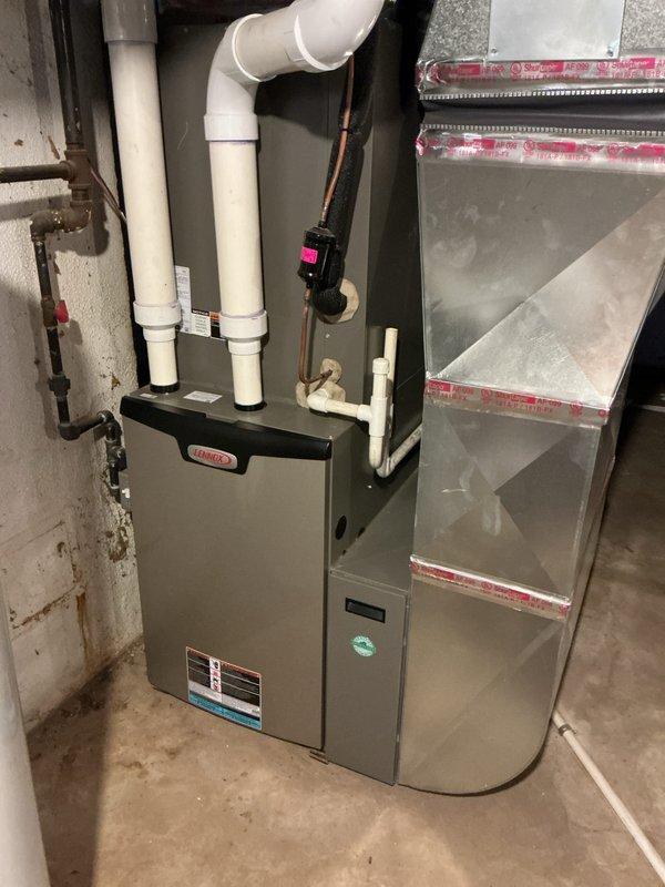 Completed annual furnace maintenance and tune-up on a 10-year-old residential heating system as part of the customer's membership benefits. Performed comprehensive inspection of the HVAC equipment, including the furnace and air handler units installed in the basement utility area. Verified proper operation of all system components, checked refrigerant lines, inspected PVC intake and exhaust venting, and confirmed all connections were secure and functioning correctly. System operating within normal parameters with no issues identified.