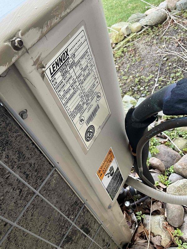 Conducted comprehensive assessment of 26-year-old HVAC system with basement-located natural gas furnace and outdoor Lennox air conditioning unit. Evaluated existing equipment condition, documented weathered outdoor condenser with accumulated debris around base, and assessed refrigerant lines and electrical connections. Prepared two separate replacement estimates: one for furnace replacement only and another for complete system replacement including both furnace and air conditioning unit.