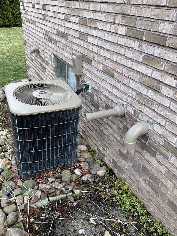 Conducted comprehensive assessment of 26-year-old HVAC system with basement-located natural gas furnace and outdoor Lennox air conditioning unit. Evaluated existing equipment condition, documented weathered outdoor condenser with accumulated debris around base, and assessed refrigerant lines and electrical connections. Prepared two separate replacement estimates: one for furnace replacement only and another for complete system replacement including both furnace and air conditioning unit.