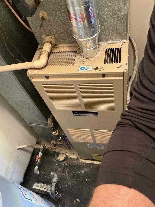 Conducted comprehensive assessment of 30-year-old natural gas furnace and air conditioning system located in main floor closet for replacement estimate. Evaluated existing equipment configuration, including furnace unit with associated ductwork, PVC condensate drainage, copper refrigerant lines, and blower assembly showing age-related wear and dust accumulation. Documented current installation layout and identified necessary considerations for replacement system installation, including existing utility connections, ventilation requirements, and structural conditions in mechanical space.