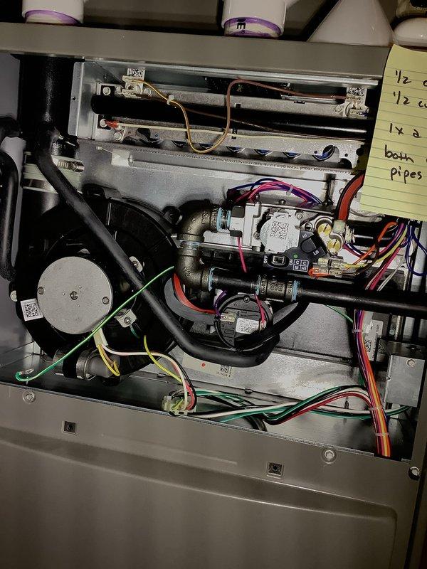 Completed comprehensive Air Care Heating maintenance on gas furnace system. Performed visual inspection of all internal components including burner assembly, gas valve, ignition system, and blower motor. Verified proper flame characteristics with blue flames burning consistently across burner assembly, confirmed gas valve operation with all electrical connections secure, and documented system condition with photos showing normal operational status. All components functioning within manufacturer specifications with no immediate repairs required.