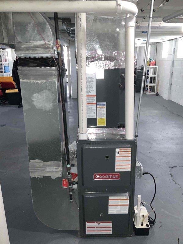 Completed comprehensive site evaluation for full HVAC system installation at residential property with no existing air conditioning infrastructure. Assessed basement mechanical room layout and existing furnace configuration to determine optimal placement for new condensing unit, air handler integration, and ductwork modifications. Documented current Goodman furnace installation, measured clearances for equipment placement including 5-inch spacing requirements for refrigerant line routing, evaluated electrical service capacity, and identified condensate pump location for proper drainage planning. Provided detailed estimate for complete air conditioning system installation with recommendations for equipment sizing and installation timeline within customer's requested two to three week timeframe.
