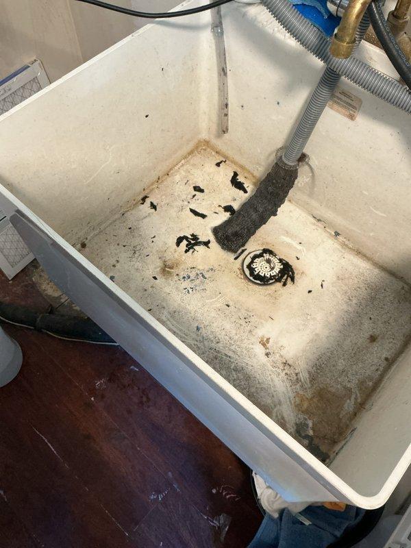 Serviced humidifier system and discovered extensive black mold growth throughout the water supply tubing and basin. Due to the severity of contamination and age of the unit (manufactured 11/2025), recommended replacement of affected components to ensure proper indoor air quality and prevent health hazards from mold spore circulation through the HVAC system.