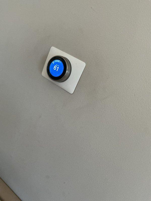 Completed routine Air Care Cooling maintenance inspection on HVAC system. Accessed air handling unit cabinet, inspected electrical components and control board with all wire connections secure and functioning properly. Verified thermostat operation displaying 67°F setpoint with proper communication to system. Unit operational with no deficiencies noted requiring immediate attention.