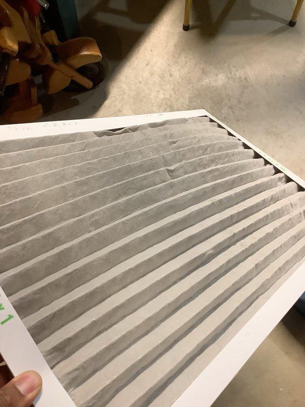 Completed scheduled Air Care Heating and Cooling maintenance service. Inspected and replaced furnace air filter which showed significant dust and particulate accumulation throughout the pleated media. Examined evaporative cooler pad, noting mineral deposits and moisture staining on the honeycomb corrugated material; pad remains serviceable with adequate airflow capacity. Both heating and cooling systems operational and ready for continued use.
