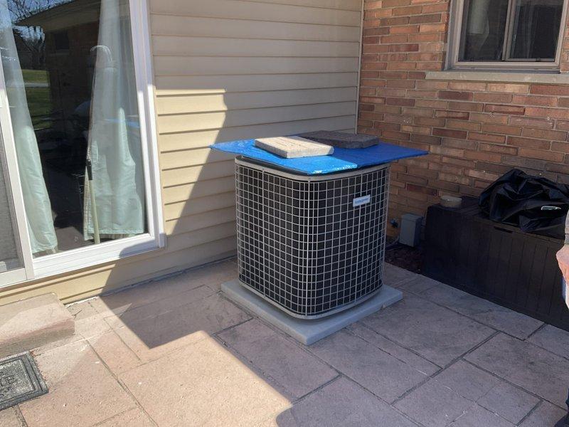 Completed comprehensive HVAC system estimate for full replacement of 20-year-old forced air heating and cooling system in ranch-style home with basement installation. Assessed existing natural gas furnace and outdoor air conditioning condenser unit currently positioned on concrete pad in residential patio area, along with existing Honeywell Home thermostat. Documented current system configuration and provided detailed replacement recommendations for complete HVAC system upgrade.