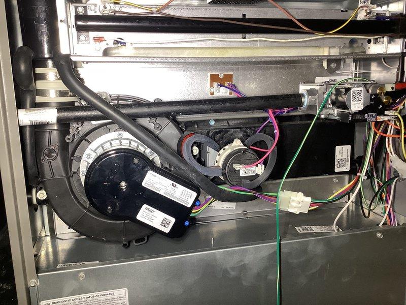 Completed annual heating maintenance on residential forced air gas furnace. Performed comprehensive system inspection including blower motor assembly, electrical components, gas burner operation, and heat exchanger. Verified proper ignition sequence and observed clean blue flame pattern across all burner ports, indicating efficient combustion. Inspected all electrical connections, control board, and wiring harnesses for proper operation. System operating within normal parameters with no deficiencies noted.