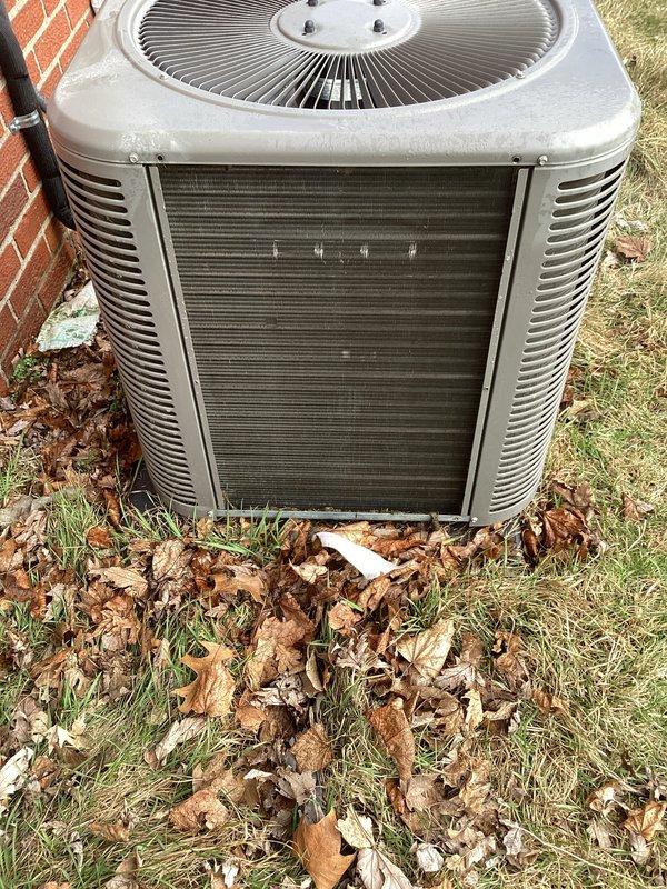 Completed annual cooling maintenance on outdoor condensing unit. Upon arrival, found condenser coil heavily clogged with dirt, dust, and organic debris, significantly restricting airflow. Removed accumulated leaves, twigs, and vegetation from base and surrounding area of unit. Thoroughly cleaned condenser coil to restore proper heat transfer efficiency. Inspected all accessible components, verified proper operation of condenser fan, and confirmed unit returned to normal operating condition.