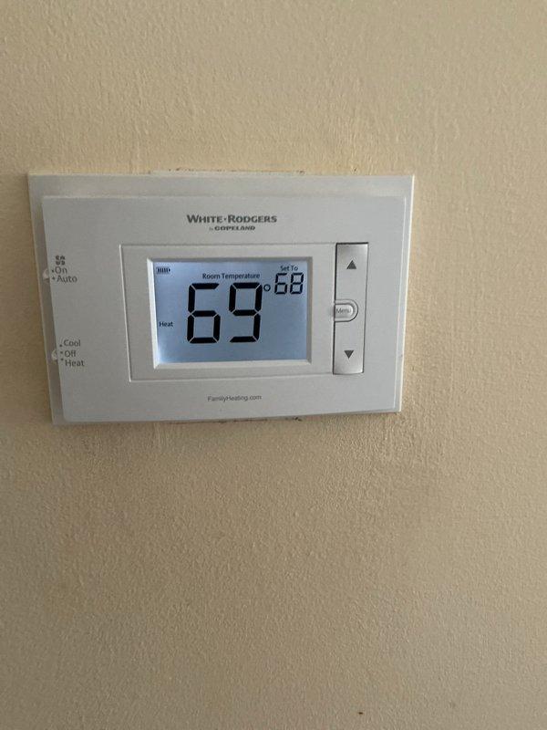 Completed scheduled Air Care Heating maintenance on residential HVAC system. Performed comprehensive inspection of furnace components, verified thermostat operation showing proper heating mode function with system maintaining 68°F setpoint, and conducted diagnostic testing of electrical systems using digital multimeter. All components operating within normal parameters with no deficiencies noted.
