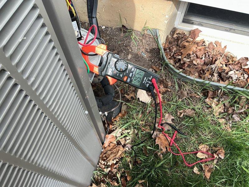 Completed annual preventative maintenance on residential air conditioning system. Performed comprehensive electrical diagnostics using digital multimeter, verifying voltage readings at outdoor condensing unit which measured within normal operating parameters at approximately 302 volts. Inspected unit components, tested electrical connections, and confirmed proper system functionality to ensure reliable operation for the upcoming cooling season.