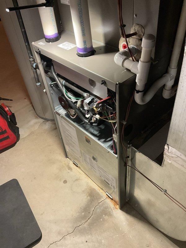 Completed comprehensive ComfortGuard preventive maintenance inspection on residential gas furnace system. Performed thorough examination of all internal components including burner assembly with ignition ports, gas valve and piping connections, blower motor assembly, electrical wiring harnesses, control board functionality, and UV air purification system. All system components found operating within normal parameters with no deficiencies noted at time of service.