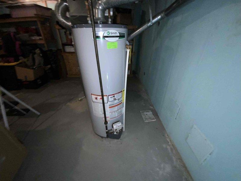 Completed full system estimate for HVAC replacement on 16-year-old furnace and air conditioning system. Assessed existing equipment condition in basement utility area, documented current system configuration including ductwork and venting arrangements, and photographed installation space to determine replacement requirements and proper sizing specifications for new heating and cooling equipment.