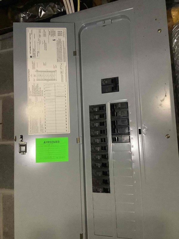 Conducted on-site electrical assessment for new whole home generator installation at single-story residential property. Evaluated existing electrical infrastructure including main service panel, exterior utility connections, and optimal generator placement location on side of home near existing AC condenser unit. Documented current electrical system configuration with approved main panel containing adequate breaker capacity for generator integration, photographed exterior wall space and utility access points for generator pad placement and fuel line routing, and verified clearance requirements for code-compliant installation of automatic transfer switch and generator unit.