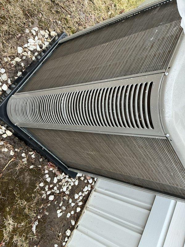 Completed routine Air Care Maintenance inspection on residential air conditioning system. Performed visual assessment of outdoor condenser unit, confirmed proper installation and structural integrity of cooling fins and exterior panels, and documented equipment condition with photographs. No repairs or adjustments required at this time.