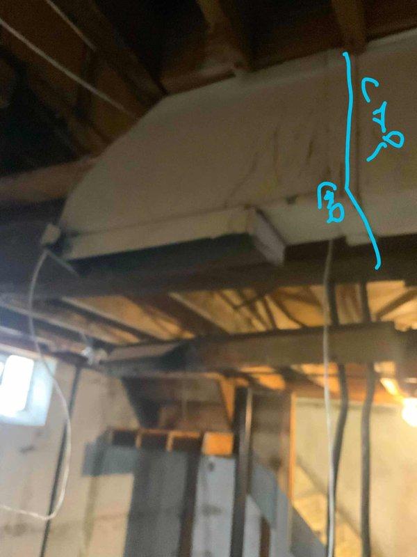 Conducted comprehensive full system evaluation for 35-year-old Kenmore HVAC system requiring replacement within the season. Assessed existing furnace and air conditioning equipment located in basement utility area, documented current ductwork configuration including ceiling-mounted air handler and distribution system, and inspected outdoor condensing unit placement along exterior pathway between building and fence line. Provided detailed replacement options and specifications for complete system upgrade to meet customer's heating and cooling requirements.