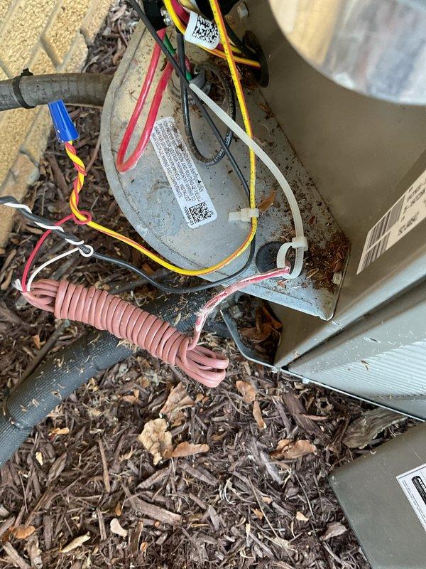 Responded to no-cooling call on 10-year-old central air conditioning system. Upon inspection, found outdoor condensing unit with significant corrosion and rust on dual run capacitor and electrical connections. Removed access panel and discovered debris accumulation inside unit compartment including leaves and organic material. Tested capacitor with multimeter and confirmed failure with readings outside manufacturer specifications. 

Cleaned debris from condenser unit interior and removed failed capacitor. Installed new dual run capacitor with proper MFD rating for compressor and condenser fan motor. Cleaned and tightened all electrical connections at contactor and capacitor terminals. Verified proper voltage at disconnect and tested contactor operation. Inspected refrigerant lines and coil for damage - copper tubing showed normal wear but no leaks detected.

Energized system and confirmed compressor and condenser fan motor startup. Measured amp draw on both motors within normal operati