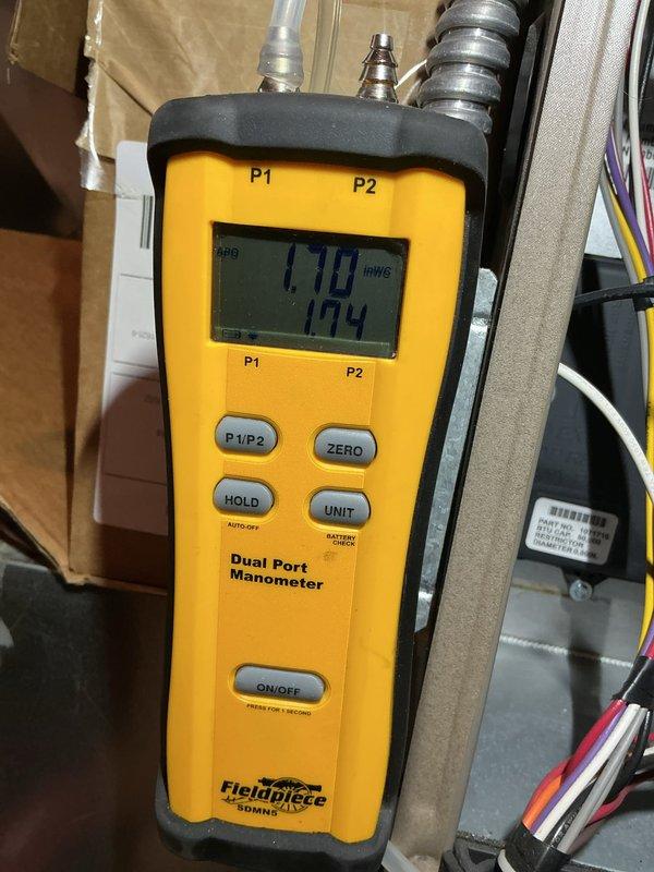 Performed combustion analysis on heating system using calibrated CO detector and dual port manometer. Measured and documented carbon monoxide levels, gas pressure readings at 1710 PSIG and 124 inWG, and verified proper combustion efficiency. Equipment tested and confirmed safe operating parameters within manufacturer specifications.