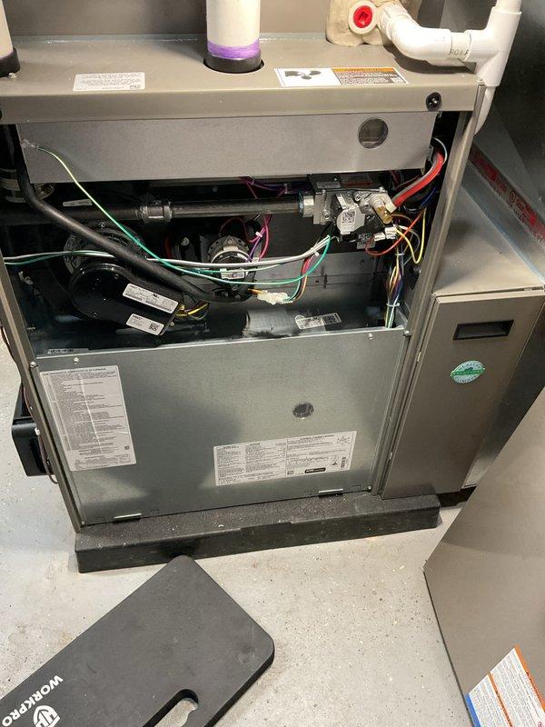 Completed annual furnace maintenance and tune-up on residential heating unit per membership agreement. Performed comprehensive inspection of all internal components including blower motor, gas valve assemblies, heat exchanger, burner assembly, electrical connections, and control modules. Verified proper operation of all safety controls, checked wire harness connections, inspected PVC venting system, and confirmed unit functionality. All components found in good working condition with no issues identified.