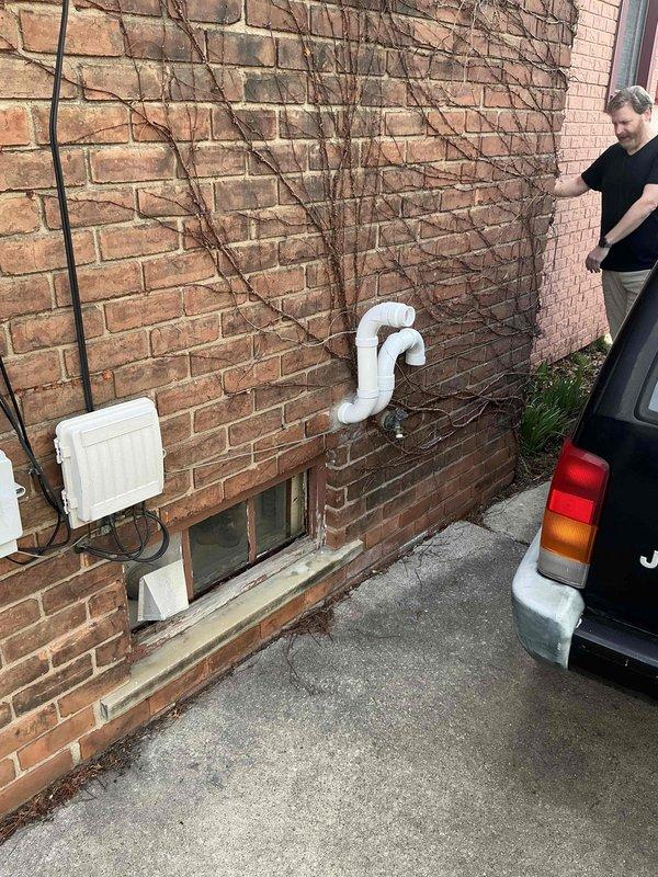 Provided estimate for replacement of existing tankless water heater at residential property. Current unit is operational but customer seeking replacement quote. Assessed exterior installation location on brick wall with existing PVC venting system and evaluated electrical service access for new tankless unit installation.