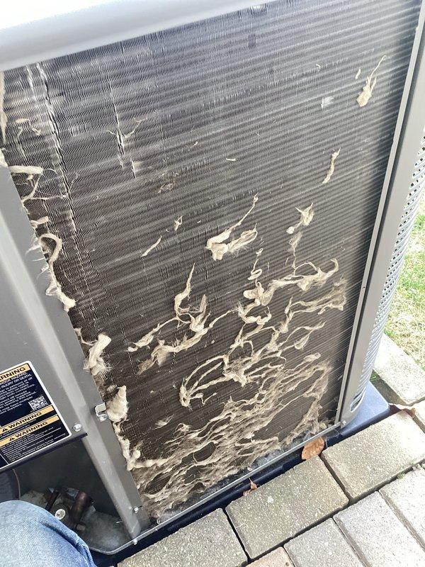 Completed annual maintenance on outdoor air conditioning unit. Upon inspection, discovered severe condenser coil deterioration with extensive fin corrosion affecting more than half of the coil surface, significantly compromising system efficiency and heat transfer capability. Documented coil condition with photos showing advanced degradation patterns and material loss throughout the fins. Cleaned accessible coil sections and removed accumulated dirt, dust, and debris buildup from condenser coil surfaces. Verified condensate drainage system operation and inspected all accessible components. Recommend immediate condenser coil replacement due to extensive deterioration that will impact cooling capacity and system performance.
